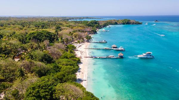 Rest your travel-worn heels on the white sands, sparkling shores, and sun-soaked stretches of Colombia’s northern coast