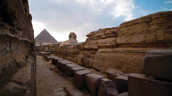 Local man with horse drawn cart waiting in front of the pyramids in Eygpt