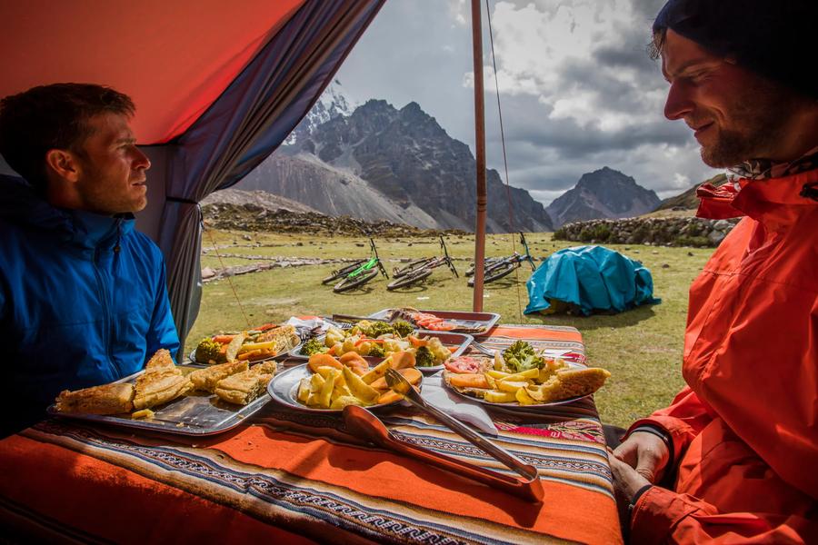 From crispy picarones to smoky pollo a la brasa, here's a dozen traditional Peruvian eats to explore