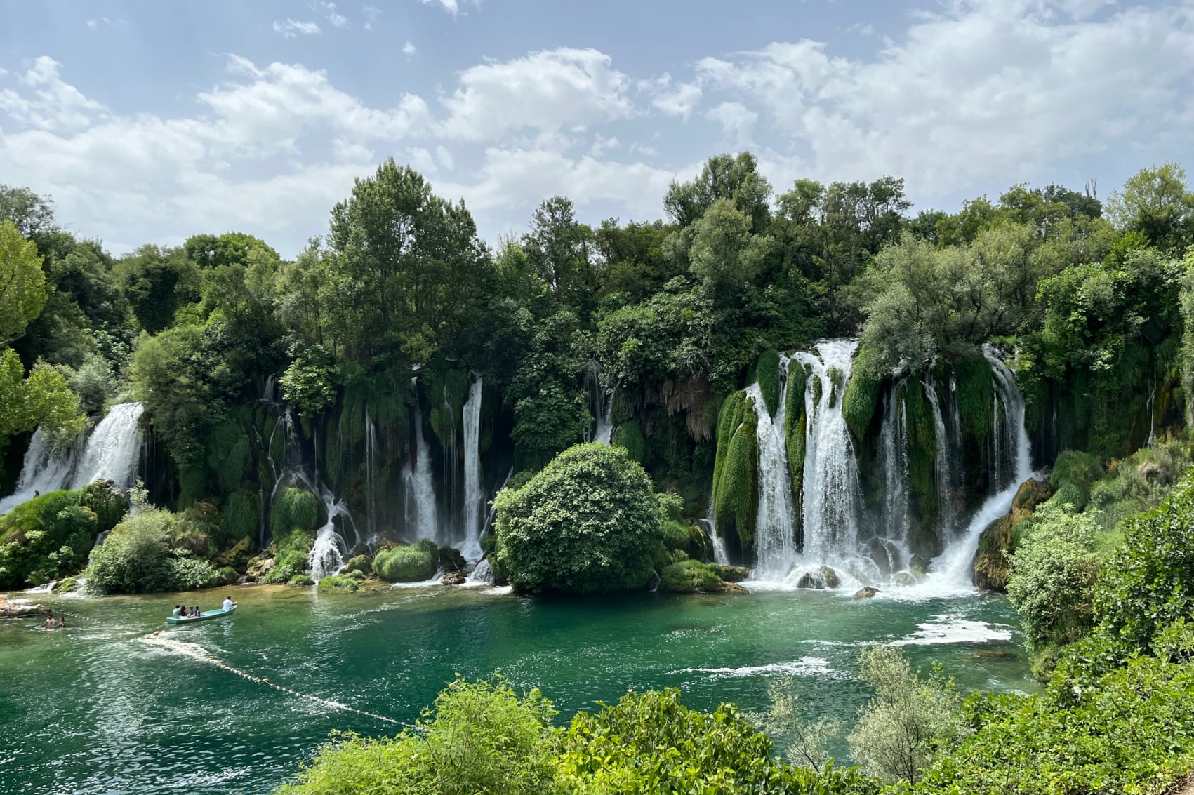 multiple cascades rush over the Kravica Falls in Bosnia