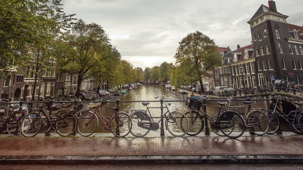 Bikes by the canal in Amsterdam