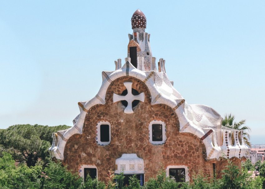 Looking down at Gaudi's famous gingerbread and whipped topping gatehouse at the entrance to Park Guell in Barcelona, Spain