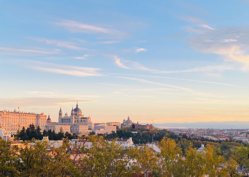 Take in a pretty sunset over the Royal Palace of Madrid and La Almudena Cathedral in central Spain before heading south