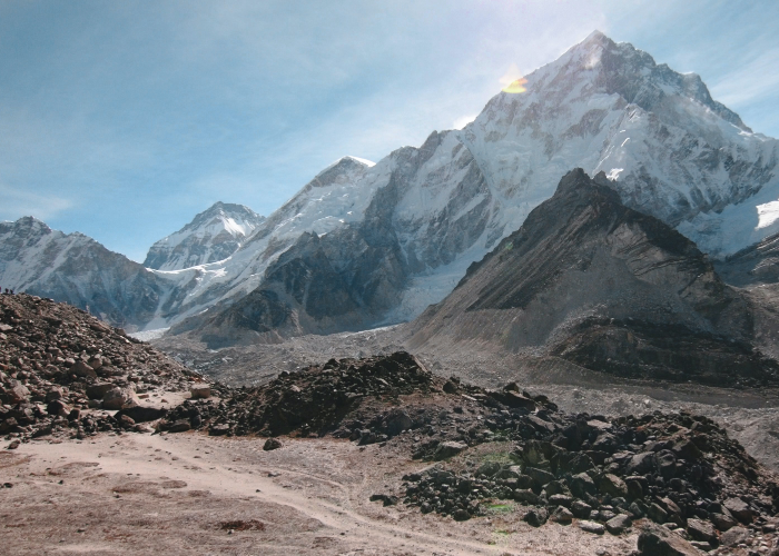 jagged peaks of Mt Everest dwarf the rocky trails below en route to Everest Base Camp